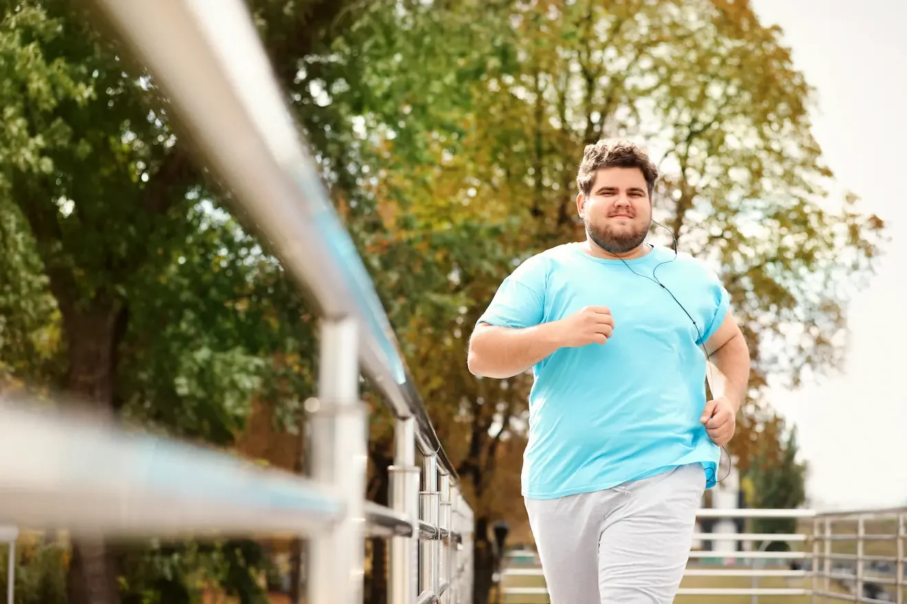 Young plus size man jogging