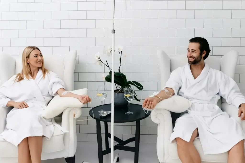 Cute couple receiving IV therapy together